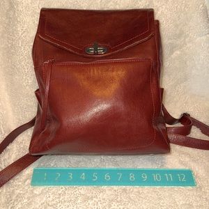 Burgundy Wilson Leather small backpack.  Minor wear see pictures.